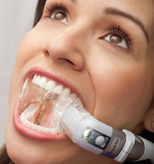 Woman with isolite in mouth